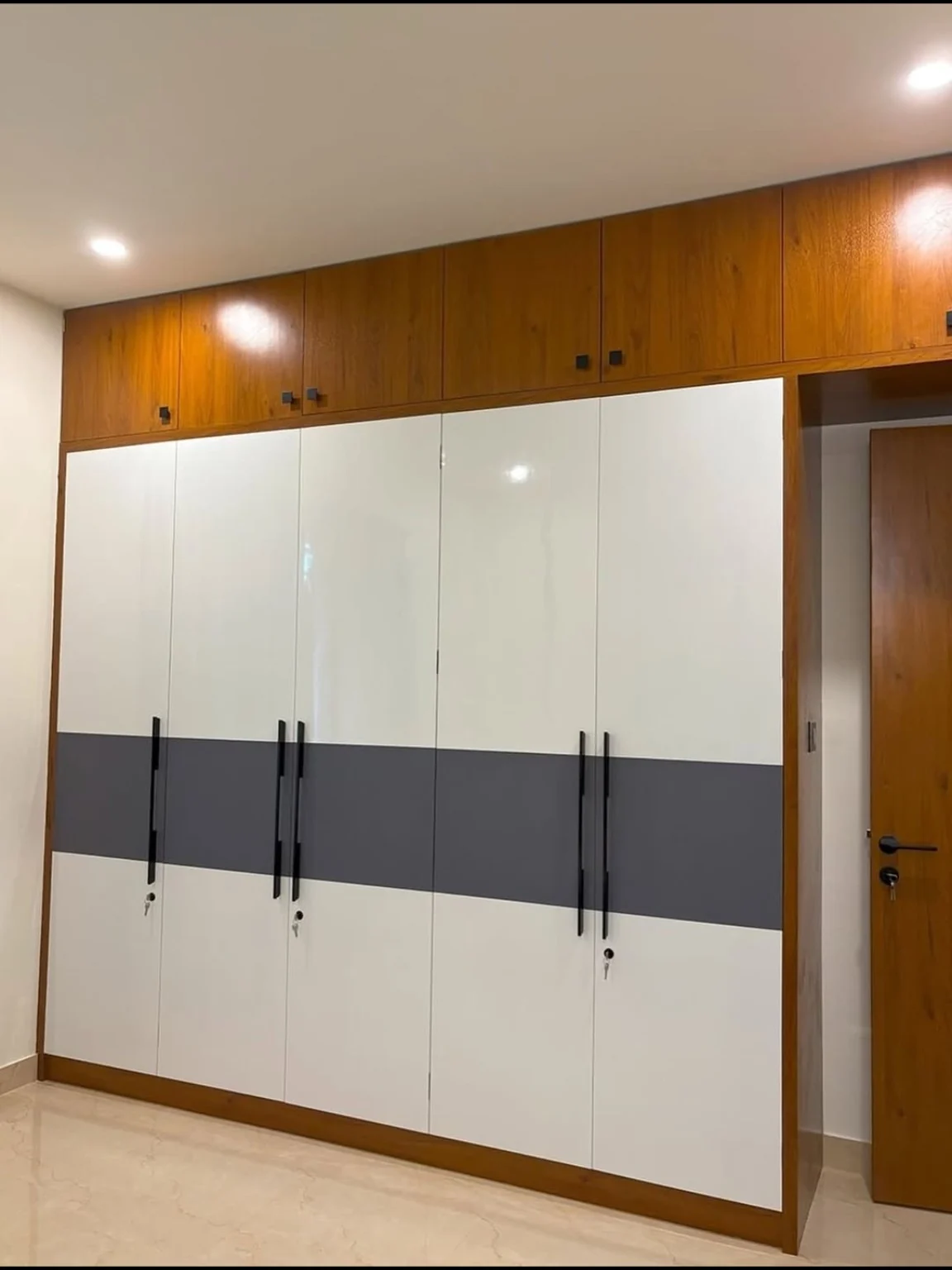 Full-height wardrobe with clean two-tone finish