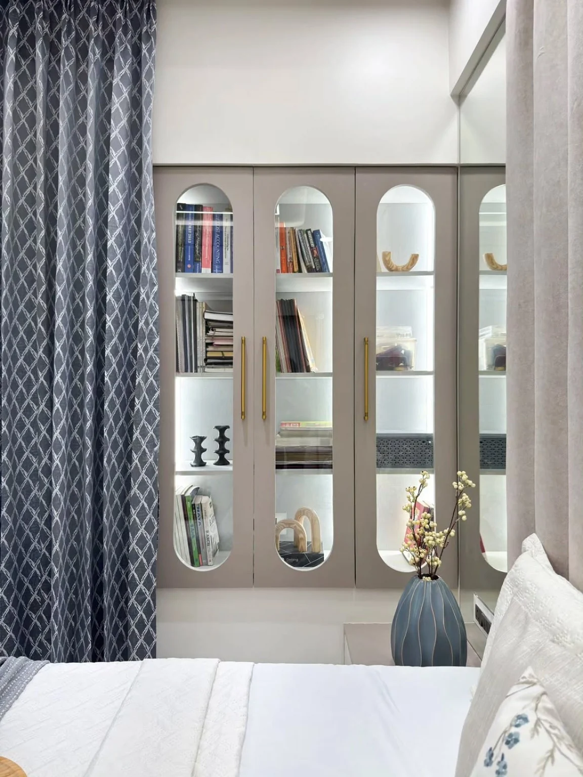 Built-in display and storage beside the bed